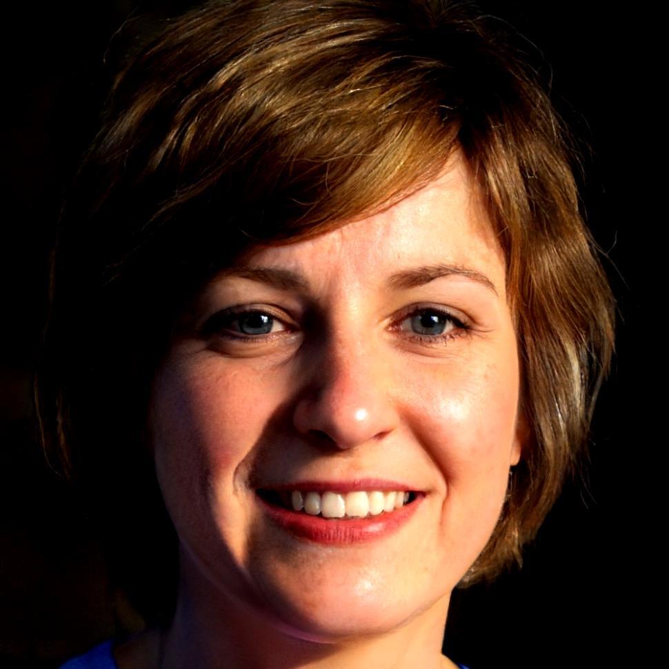 Senior budget analyst reviewing financial data with focus on trend patterns